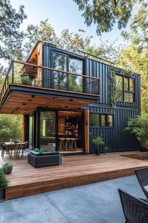 Two story house built with shipping containers with balcony and wooden porch. Check out these shipping container homes and learn their advantages, design appeal, and unique characteristics. Container Home With Deck, Three Container House, Shipping Container Homes Two Story, Container Homes Ideas Design Two Story, Two Story Container Home, 2 Story Container House, Two Story Adu, Container Office Design, Roof With Windows