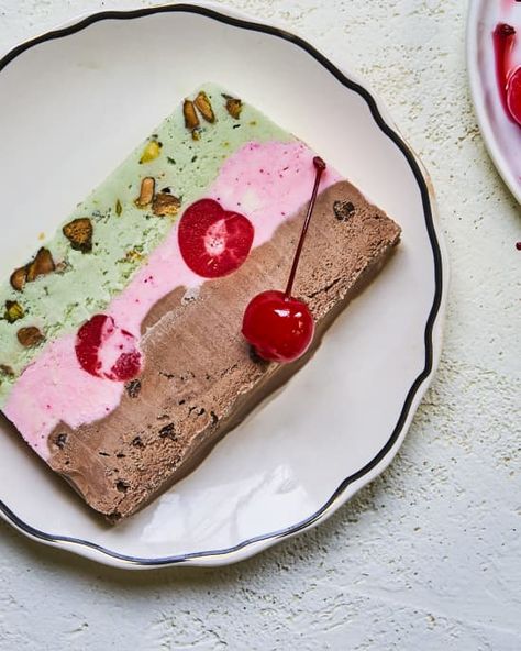 a slice of Spumoni ice cream cake (a layered combination of pistachio, cherry and chocolate ice cream with whole cherries inside) Spumoni Recipe, Spumoni Dessert, Spumoni Ice Cream, Tasty Ice Cream, Resipi Kek, Cherry Ice Cream, Ice Cream Cake Recipe, Pistachio Ice Cream, Chocolate Chip Ice Cream