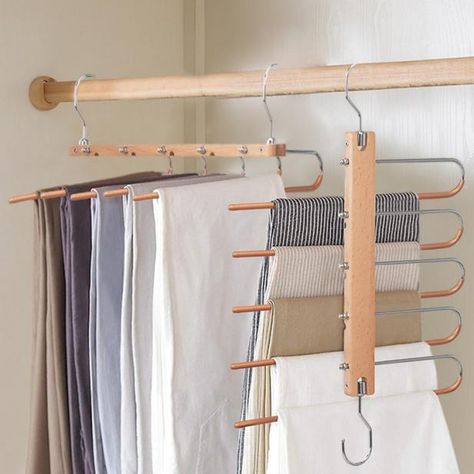 HGTV editors share the best clothes hangers to buy online right now, including hangers for baby clothes, wooden hangers, pants hangers and more. Space Saving Closet, Best Clothes Hangers, Clothes Trousers, Best Hangers, Magic Pants, Clothing Hanger, Pants Hangers, Wardrobe Organizer, Trouser Hangers