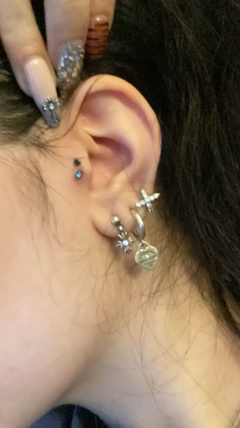 #chromehearts #piercing #tragus #tiffany Ear Piercings Coquette, Piercing Own Ear, Different Earrings In Each Ear, Earrings 2000s, Small Ears With Piercings, Triple Lobe Piercing Silver, Gauges And Ear Piercings, New Piercing, Dream Piercings