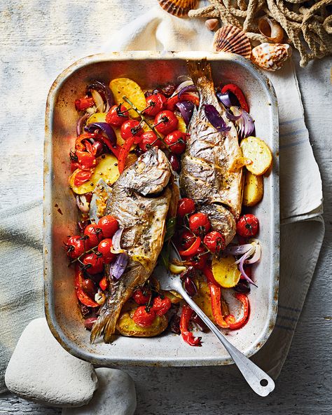 Roasting fish whole adds extra flavour and keeps it moist. In this Greek-inspired recipe, we’ve paired sea bream with oregano, Kalamata olives, garlic and cherry tomatoes for an all-in-one summer supper Whole Sea Bream Recipes, Sea Bream Recipes Whole, Bream Fish Recipe, Fish And Vegetable Recipes, Whole Rainbow Trout Recipe, Sea Bream Recipes, Rainbow Trout Recipe, Greek Seafood, Greek Fish