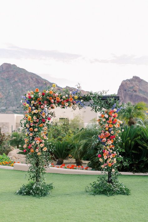 Colorful Ceremony Backdrop, Ceremony Flowers Altar Outdoor, Bright Floral Arch, Colorful Flower Arch, Spring Wedding Flower Arch, Colourful Wedding Arch, Wedding Arch Colorful, Wedding Arch Florals, Vibrant Spring Wedding