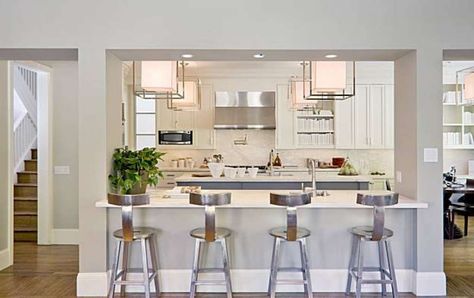 The home's kitchen includes a marble island and breakfast bar. Photo: Scott Hargis Photography Breakfast Bar Window, Kitchen Columns, Bar Window, Farmhouse Kitchen Island, Small Space Kitchen, Open Concept Kitchen, Modern Farmhouse Kitchens, Kitchen Diner, Kitchen Remodel Idea