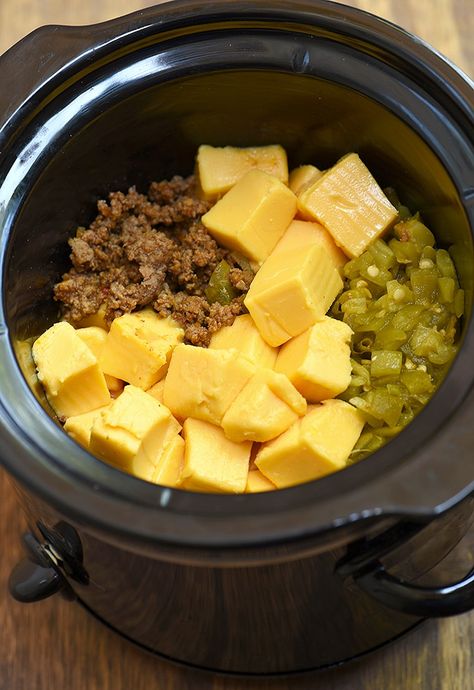 Beef Cheese Dip made easy in the slow cooker! Loaded with taco meat, cheese, and diced green chilies, it's seriously addicting! Cheese Steak Dip Crock Pot, Green Chili Cheese Dip, Velveeta Queso Dip Crock Pot, Crockpot Snacks, Food Slow Cooker, Chili Cheese Dips, Crock Pot Dips, Simple Pantry, Diced Green Chilies