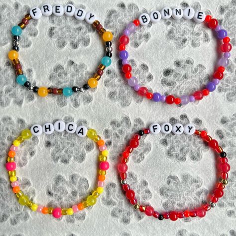 ❁ Beaded bracelets made by me ❁ FNAF Five Nights at Freddy’s inspired bracelets ❁ Made with clear stretch thread, seed beads, round beads, glow in the dark beads and letter beads ❁ Bracelet and size requests available ❁ Link to store in my bio ❁ Prices from $5 ❁ More info on my etsy and ig #fnaf #fnafbracelet #fivenightsatfreddys #foryoupage #fyp #bracelets Fnaf Friendship Bracelet, Fnaf Bracelet, Halloween Bracelet Diy, Glow In The Dark Beads, Inspired Bracelets, Letter Bead Bracelets, Halloween Bracelet, Summer Glow, Bracelet Diy