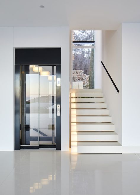 GRAS Reynés Arquitectos, José Hevia · Where Eagles Dare · Divisare Stairs And Elevator Design Home, Lift And Staircase Lobby Design, Staircase Design With Lift, Staircase And Elevator Design, Modern Indoor Staircase, Stair With Elevator Design, Staircase Around Lift, Lift Staircase Design, Elevator Stairs Design