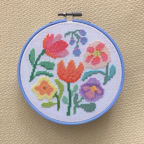 "Bring some happiness with this colourful flower hoop design. A counted cross stitch pattern and instructions for you to stitch a beautiful design for your home or as a thoughtful gift for a loved one Size of the design: The design is 72 stitches high and 73 stitches wide. The size depends on the count of aida that you choose to stitch on. The design in the photo is stitch on 14 count aida and fits perfectly in a 6\" hoop If you stitched it on 11 count aida it would be a 7\" hoop and 16 count ai Easy Cross Stitch Patterns, Graphic Floral, Colourful Abstract, Abstract Graphic, Beautiful Cross, Cute Cross Stitch, Floral Cross Stitch, Screen Free, Simple Cross Stitch