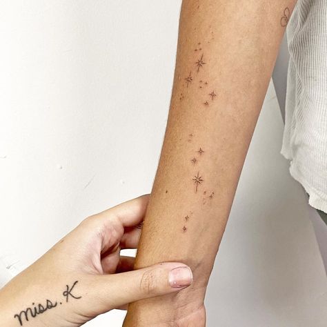 Scorpio Zodiac Star Tattoo, Stars On The Shoulder Tattoo, Sparkles Arm Tattoo, Freckles Star Tattoo, Star Tattoos Forearm, Constellation Wrap Around Tattoo, Arm Stars Tattoo, Twinkly Star Tattoo, Sparkle Tattoo Forearm