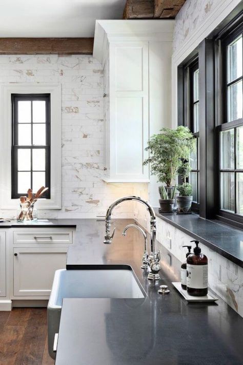 Instead of a minimal backsplash, the new kitchen and bath models showcase floor-to-ceiling paneling. Homes With Wrap Around Porches, Boston House, Home Bunch, Black Countertops, This Old House, White Kitchen Design, Classic Home, Wrap Around Porch, Kitchen Redo