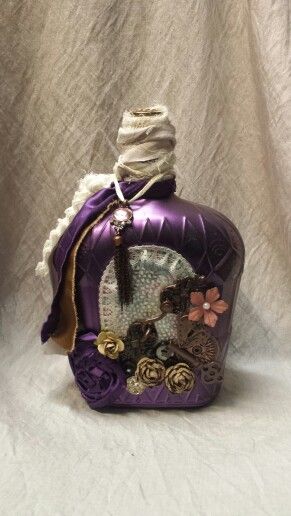 Purple crown royal bottle Crown Royal Bottles Ideas, Altered Bottles Diy, Jar Upcycle, Fancy Bottles, Old Liquor Bottles, Decorating Bottles, Bedazzled Liquor Bottles, Bottle Art Projects, Crown Royal Bottle