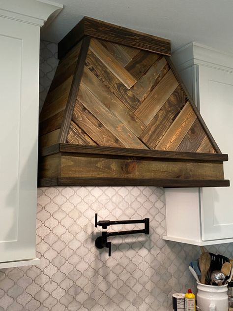 Pickets from Home Depot (both cedar and pine).  4 different stain colors.  Trim, power tools, and patience. Barnwood Range Hood Cover, Oven Hoods Wood, Barnwood Range Hood, Stove Hoods Ideas Oven Range Over Island, Herringbone Range Hood, Wood Kitchen Range Hood, Wooden Extractor Hood, Rustic Kitchen Range Hood Ideas, Vintage Stove Hood