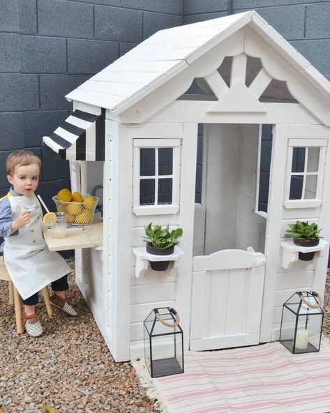 An outdoor playhouse renovation. Outdoor playhouses are the perfect summertime activity for kids of all ages. We took this playhouse from bland to palm springs chic with just a few DIY steps! Cubby House Paint Ideas, Custom Playhouse Outdoor, Wooden Playhouse Interior, Step2 Cottage Playhouse Makeover, Playhouse Renovation, Playhouse Decorating Ideas, Backyard Discovery Playhouse, Playhouse Backyard, Backyard Playhouse Ideas