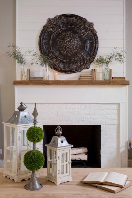 Copy This Look: This stunning mantel centerpiece began its life as a ceiling medallion. To recreate this look at home, find an inexpensive medallion at your local home improvement store, then paint or stain to match your home's decor. Fixer Upper Wall Decor, Shiplap Paneling, White Brick Fireplace, Fixer Upper Decor, Hgtv Fixer Upper, Wood Mantle, Shiplap Fireplace, Decor Ikea, Magnolia Market