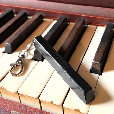 "Our vintage piano key keychain makes a unique and harmonious accessory that brings a touch of musical history to your everyday life. Crafted with precision and passion, each keychain is made from an authentic vintage piano key, transforming a piece of musical heritage into a stylish and functional keepsake. SIZE: each key is approximately 3 1/2\" x 1/2\" Features: Authenticity and Heritage: Every keychain is carefully sourced from vintage pianos, preserving the rich history and character of eac Repurpose Piano Keys, Piano Hammers Repurposed, Piano Repurpose Upcycling, Old Piano Repurpose Ideas, Piano Parts Repurposed, Piano Keys Repurposed, Piano Upcycling, Repurpose Piano, Piano Upcycle