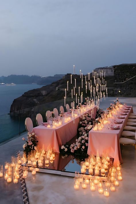 Set the stage for an unforgettable evening with a magical soiree. Soft candlelight and a breathtaking view make for a perfect romantic beach wedding by the cliff! Beach Dinner Decor, Candle Set Up, Beach Engagement Party Ideas, Candle Only Centerpieces Wedding, Beach Cliff Wedding, Beach View Wedding, Wedding Decorations Romantic, Ocean Theme Wedding, Lake Wedding Reception