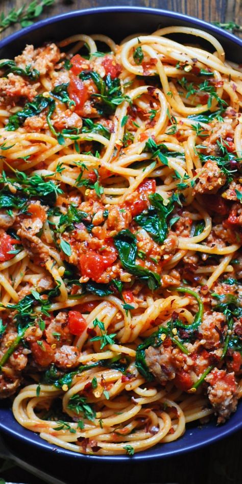 Italian Sausage Spaghetti in a blue bowl. Sausage Spinach Spaghetti, Quick Italian Sausage Recipes, Spicy Sausage Spaghetti, Spaghetti With Sweet Italian Sausage, Spagetti And Sausage, Italian Sausage Meat Sauce, Spaghetti Recipes Italian Sausage, Ground Italian Sausage Recipes Gluten Free, What To Make With Spicy Italian Sausage