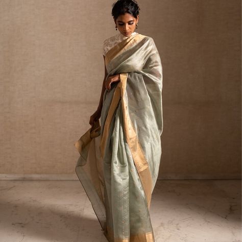 From our exclusive collection KHOJ : Bimal, a sage green chanderi silk saree that sees intricacies of small butis in vintage gold. #priyankaraajiv #fashiondesigner #saree #bigfatindianwedding #iwearhandloom #sixyardsofelegance #sareelovers #sotd #sareesofinstagram #weavesofindia Sage Green Indian Outfit, Sage Saree, Sage Green Saree, Saree Portrait, Saree Aesthetics, Indian Fits, Saree Drapes, Concept Shoot, Shoot Poses