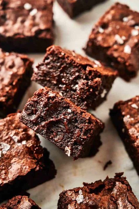 Close-up of several slices of rich, fudgy chocolate brownies with a flaky, cracked top and sprinkles of sea salt. Quick Brownie Recipe, Air Fryer Brownies, Chewy Chocolate Brownies, Chocolate Brownies Recipe, Comfort Food Desserts, Quick Treats, Winter Comfort Food, Brownie Ingredients, Delicious Brownies