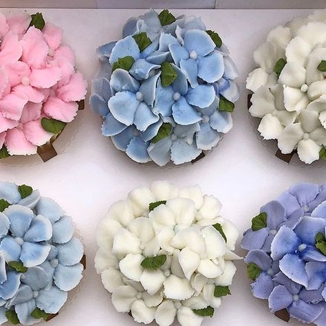 Boston Baked Blossoms on Instagram: "All the colors! #buttercream #gardenparty #partyplanner #weddingplanner #events #anniversary #engagementparty #eventplanner #weddingbells #buttercreamcupcakes #engagement #bridalshower #desserts #weddingcakes #weddingcake #weddingvibes #letscelebrate #bridalshowercake #cupcakes #weddingideas #cupcakebouquet #babyshowerideas #birthday #babyshower #babyshowercake #birthdaycake #flowercupcakes #hydrangea #buttercreamfrosting" Hydrangea Gender Reveal, Bridal Shower Flower Cupcakes, Hydrangea Cupcakes Tutorial, Nantucket Bachelorette, Hydrangea Cupcakes, Cupcake Flowers, Cupcake Tree, Bachelorette Cake, Engagement Cookies