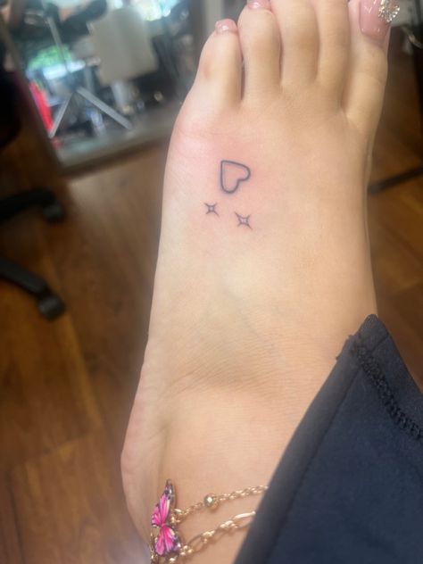 Small Hearts And Stars Tattoo, Heart Feet Tattoos, Tattoo Ideas On The Ankle, Red Ink Finger Tattoos For Women, Different Color Tattoos, Small Cute Thigh Tattoos, 200s Tattoos, Easy Ankle Tattoo, Heart Y2k Tattoo