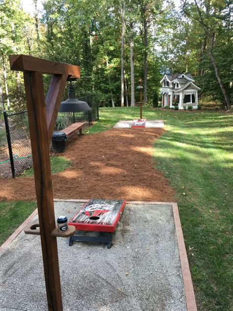 Cornhole And Horseshoe Pit, Cornhole Patio Ideas, Fire Pit And Corn Hole, Cornhole Board Playing Area, Build Backyard Games, Backyard Corn Hole Court, Corn Hole Yard Designs, Corn Hole Playing Area, Cornhole Pit Ideas