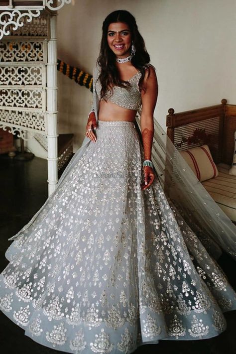 We absolutely love how her Bridal Glow looks more radiant in that Silver Lehenga. If You looking for Trendy Bridal Lehenga, We have complied a great collection of Silver Bridal Lehenga to take inspiration from. Check them all out in the link attached below.    #indianwedding #shaadisaga #intimatewedding #bridallehenga #bridalfashion #offbeatlehenga #uniquelehenga #indianbridaltrends #indianweddingtrends #silverlehenga #greylehenga #embellishedlehenga #sequinlehenga Silver Lehenga, भारतीय दुल्हन संबंधी, डिजाइनर कपड़े, Indian Outfits Lehenga, Nikkah Dress, Lehnga Dress, Designer Bridal Lehenga, Indian Bridal Lehenga, Salwar Kamiz