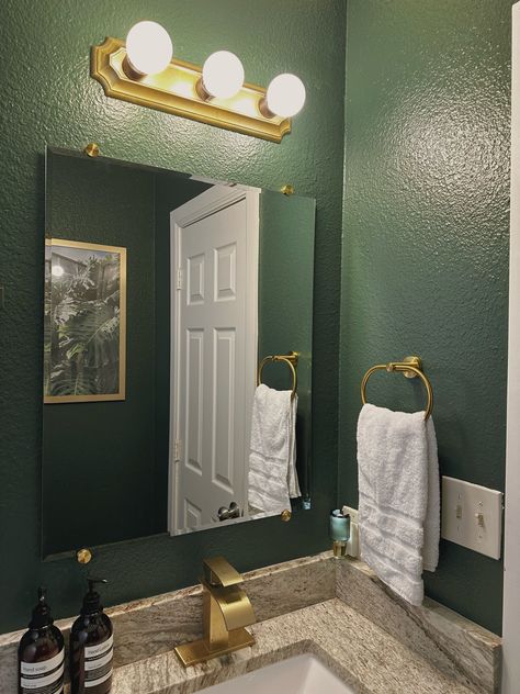 Dark green walls, with gold hardware Emerald Gold Bathroom, Dark Green And Gold Decor, Dark Green And Gold Bathroom Ideas, Green Black And Gold Bathroom, Black And Green Apartment Aesthetic, Green And Silver Bathroom, Dark Green And Gold Bathroom, Gold And Green Bathroom, Emerald Green And Gold Bathroom