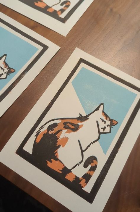 This is a limited series of linocut prints featuring the most gorgeous of creatures, the calico cat. Meticulously handcrafted, each print captures the grace and vibrant beauty of the beloved feline companion. With only a limited number available, this artwork is a cherished find for cat and art enthusiasts alike. Add a touch of elegance to your space or surprise a loved one with this captivating piece of feline-inspired art. Cat Linocut, Magnolia Print, Stamp Carving, Gift For Cat Lover, Linocut Art, Cat Owner, Calico Cat, The Grace, Linocut Prints