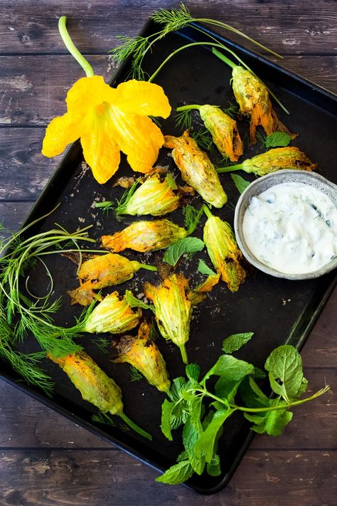 Baked Stuffed Squash Blossoms (Dolmas Style!)with ground lamb, basmati rice and fragrant Middle Eastern spices- a simple delicious main course or appetizer, inspired by the season! #dolmas #squashblossom #zucchiniblossom #squashblossoms #stuffedsquashblossom #baked #lamb #lambrecipes #groundlamb via @feastingathome Stuffed Squash Blossom, Vegetarian Zucchini Recipes, Squash Blossom Recipe, Stuffed Squash Blossoms, Summer Suppers, Easy Delicious Appetizers, Zucchini Recipes Baked, Best Zucchini Recipes, Stuffed Squash