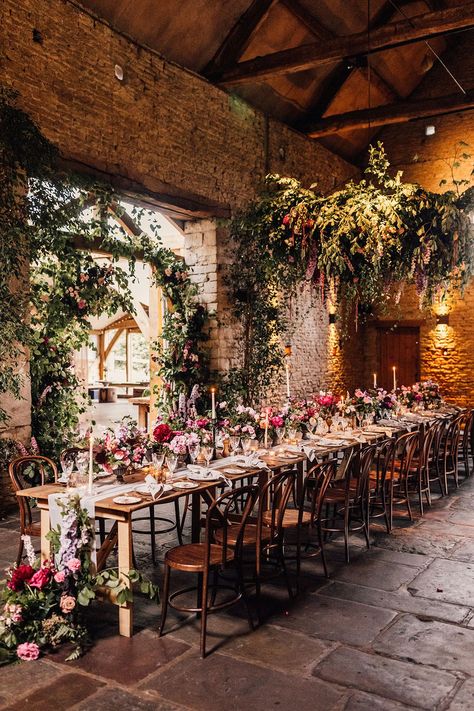 One long banquet table for an intimate wedding decorated with pink and purple flowers and candles for cosy romantic wedding Extravagant Wedding Decor, Botanical Wedding Theme, Wedding Sign Decor, Colorful Wedding Flowers, Wedding Venues Uk, Spring Wedding Flowers, Rock My Wedding, Wedding Breakfast, Rustic Barn Wedding