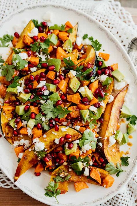 This beautiful, bright Winter Salad showcases some of my favorite cold weather produce - sweet acorn squash, creamy sweet potatoes and tart pomegranate. This healthy sheet pan side comes together with very little effort and even less cleanup. Acorn Squash Sweet Potato, Acorn Squash And Sweet Potato Recipes, Salad With Acorn Squash, Roasted Acorn Squash And Sweet Potato, Squash Pomegranate Salad, Kale Butternut Squash Pomegranate Salad, Bbq Acorn Squash, Thanksgiving Salad Recipes, Thanksgiving Salad