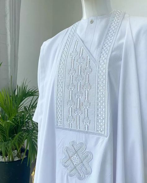 A Snow White dotted round and straight line embroidery agbada with silv - Afrikrea White Agbada Designs For Men, White Agbada Styles Men, Latest Agbada Styles Men, Agbada Styles Men Wedding, White Agbada Designs, Latest Agbada Designs, Agbada Styles Men, Agbada Designs For Men, White Agbada