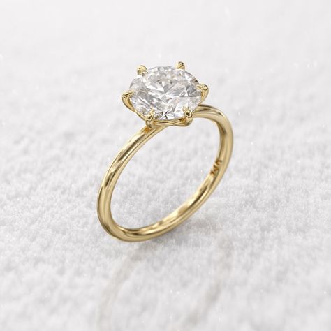 Gold solitaire engagement ring