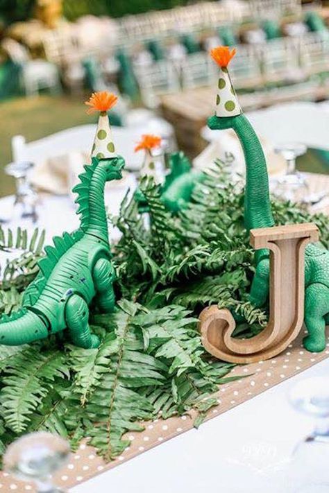 50 Roar-Worthy Dinosaur Party Ideas Your Kids Will Love 2 Dinosaur Centerpieces, Dinosaur Party Centerpiece, Creative Birthday Party Ideas, 4de Verjaardag, Dinosaur Birthday Theme, Pallet Tables, Dinosaur Birthday Party Decorations, Dino Eggs, Dinosaur Themed Birthday Party