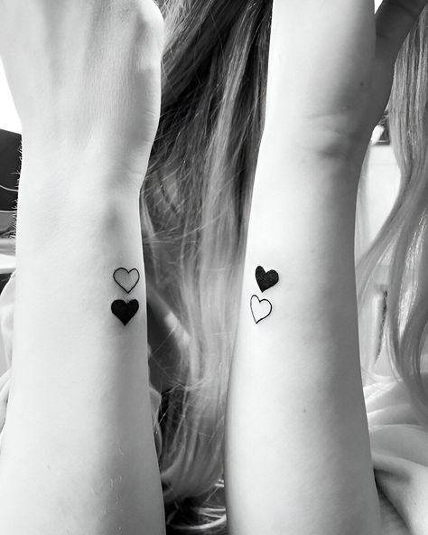 27 Feminine Best Friend Tattoos With The Perfect Elegant Touch Matching Heart Tattoos Sisters, Small Heart Sister Tattoos, Two Hearts Tattoo Best Friends, Heart Friend Tattoos, Finger Bff Tattoo, 2 Sister Matching Tattoos, Matching Hearts Tattoos, Easy Best Friend Tattoos, Small Relationship Tattoos Simple