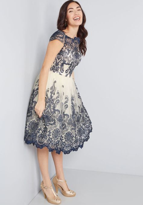 Make an unforgettable entrance in this decadently embroidered dress by Chi Chi London! With an ornate illusion neckline, intricate scalloped lace, and a full, tulle-lined skirt, this navy blue and cream frock exudes timeless feminine flair. Blue Formal Outfit, White Frock, Form Fitting Clothes, Plus Size Vintage Dresses, Tulle Underskirt, Lace Dress Styles, Gaun Fashion, Chi Chi London, Look Vintage