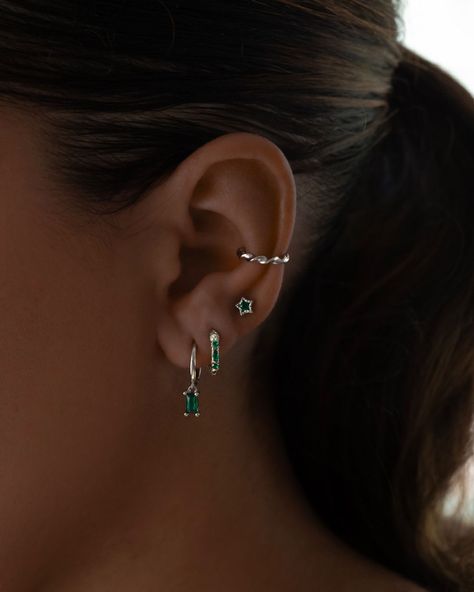 Make them green with envy💚 Upgrade your ear stack in our £10 sale!✨ Emerald Earrings Silver, Emerald Ear Stack, Ear Stack Silver, Earring Stacks Silver, Emerald Piercing, Silver Ear Stack, Emerald Earring, Earring Stack, Ear Style