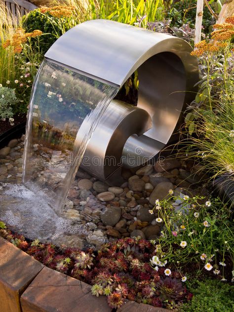 Sensory Garden Water Fountain Sculpture. Close up of a water fountain sculpture set amongst herbs and flowers in a sensory garden stock photography Water Sculpture Fountain, Modern Fountains Outdoor, Sensory Garden Design, Fountain Sculpture, Yard Fountain, Water Fountain Design, Fountain Ideas, Sculpture Fountain, Water Sculpture