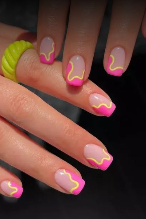 Get ready to make a statement with these vibrant neon nails for summer! Embrace the bold and bright colors that will perfectly complement your summer outfits and beach vibes. Stand out and express your fun personality with these eye-catching nail designs. Whether you prefer neon pink, green, orange, or yellow shades, there's a stunning option for everyone. Switch up your manicure game this season and let your nails do the talking. Bright Nails Designs Neon Art Ideas, Neon Pink And Yellow Nails Art Designs, Neon Nail Inspo Acrylic, Short Neon Nail Designs, 80s Nails Designs Simple, Pink Lemonade Nail Designs, Pink Yellow And Orange Nails, Orange And Hot Pink Nails, Neon Square Nails