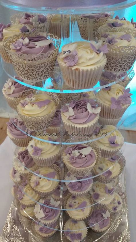 Quince Cupcakes Ideas, Lilac Cupcakes Wedding, Lilac And Champagne Quince, Lilac Cupcakes Lavender, Lilac And White Wedding Theme, 15 Birthday Cake Purple, Tangled Party Table Decor, Quinceanera Cupcakes Ideas, Purple Tiered Cake