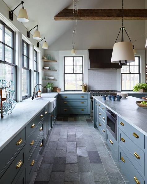 Cook up an enviable kitchen design with the addition of floor tiles made from a natural stone — like quartzite. Quartzite tiles come with a hefty price tag but are worth the investment when it comes to their durability and longevity. Each tile is unique and, when installed as flooring, creates a high-end design. Coin Banquette, Traditional Brick Home, Casa Vintage, Blue Cabinets, New England Homes, Kitchen And Bath Design, White Modern Kitchen, Bad Design, Built In Cabinets