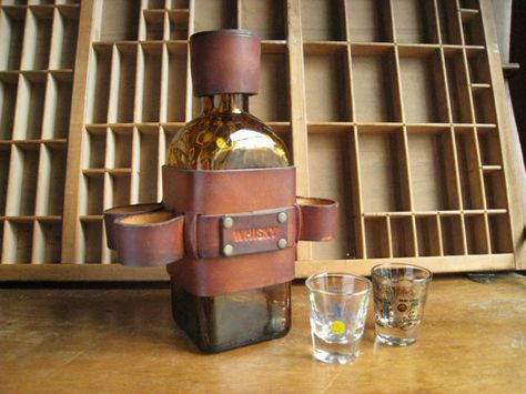 whiskey bottle holster with shot glass holder Shot Glass Holder, Whisky Bottle, Leather Craft Projects, Leather Label, Leather Harness, Shot Glasses, Bottle Holders, Amber Glass, Guitar Pick