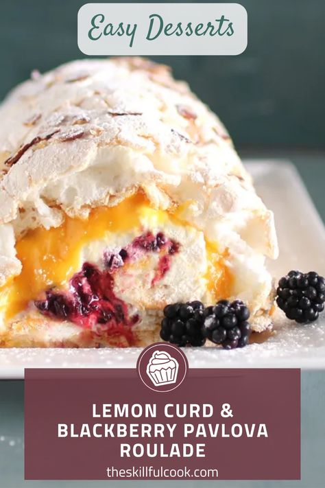 Unleash a zesty twist on your dessert with this Lemon Curd & Blackberry Pavlova Roulade recipe! A luscious blend of sweet, tangy, and utterly refreshing flavors, this treat is not just a delight to your palate but a feast for the eyes too. A meringue roulade, brimming with homemade lemon curd and blackberry compote, offering a beautiful balance of flavors in each bite. Perfect for gatherings or a decadent treat just for you. Don’t let this vibrant dessert slip away – Save this pin now! Blackberry Pavlova, Lemon Roulade Recipe, Meringue Roulade Recipe, Lemon Curd Pavlova Recipe, Roulade Recipe Desserts, Lemon Roulade, Lemon Meringue Roulade, Raspberry Roulade, Mini Pavlova Lemon Curd