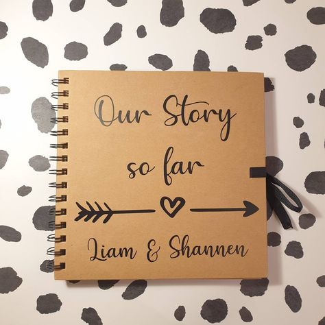 Our Story so Far Scrapbook!  These can be personalised with any name to make the perfect gift!  These scrapbooks would make a lovely gift for any occasion for the happy couple to keep all of their memories in so that they can look back on them for years to come!  Notebook Details... Size: 8 x 8 inches 80 pages Any questions just ask!  If you like my products please favourite my shop, so you can stay up to date on my latest products and projects.  You can also find us on these... https://www.inst Memories Notebook Ideas Boyfriend, Our Story Book Diy, Diary Making, Couples Anniversary Gifts, Memory Book Cover, Quotes Doodles, Boyfriend Scrapbook, Romantic Scrapbook, Couple Scrapbook