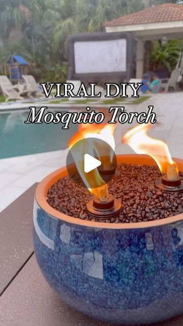 Jennifer Amarteifio | DIY Home | Faith | Lifestyle on Instagram: "Super easy and beginner friendly DIY project that keeps those pesky mosquitos away and also elevates your outdoor space! I made this last summer and it’s still holding up and works very well! 

I purchased all my supplies from @walmart for under $50. You can find all items on my Walmart storefront 🔗 in bio. 
+ planter
+ 3 torch canisters
+ bottle of tiki torch fuel + sand
+ aquarium gravel

#diytabletorch #mosquitorepellant #mosquitohack #diyoutdoorprojects #summerdiy #summerprojects #womenwhodiy #tabletopfirepit #diydecor #diyhomeprojects #diyideas #walmartcreator #walmartpartner #tikitorch
#tabletoptikitorch" Deck Tiki Torch Ideas, Diy Bug Repellent Torches, Mosquito Repellent Candles Diy, Diy Mosquito Repellent Tiki Torches, Citronella Candles Diy Outdoor Parties, Tiki Torch Planter Diy, Outdoor Tiki Torch Ideas, Tiki Torches Around Pool, Tiki Torch Ideas Backyards