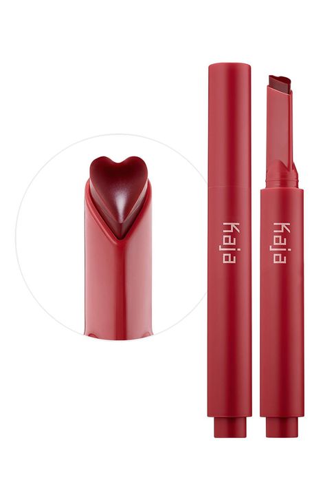 What it is: A heart-shaped gloss stick that combines nourishing lip oils with high-shine color.What it does: Enjoy a hint of color, the shine of a gloss and the nourishing benefits of a balm, all in one. Infused with vitamin-rich argan and plump seed oils, this nonsticky formula melts upon application, leaving lips moisturized with a high-shine finish. The heart-shaped applicator fits in the Cupid's bow for effortless application. Dispense the perfect amount every time—click twice for best application results. Made in Korea Kaja Beauty, Lip Gloss Stick, Plum Seed, Lip Oils, 밈 유머, Soften Lips, Seed Oils, Gloss Labial, Makeup Items