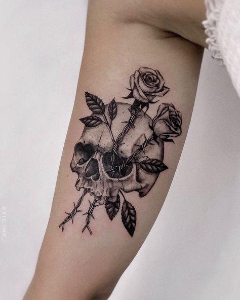 Tattoo of a skull with barbed wire roses. Black and grey, detailed, fineline tattoo. Skull With Lily Tattoo, Barbed Wire Tattoo Arm Sleeve, Woman’s Skull Tattoo, Flower And Barbed Wire Tattoo, Skull And Lily Tattoo, Tattoo Ideas Skull Women, Women’s Skull Tattoo, Skull With Barbed Wire Tattoo, Skull And Roses Tattoos For Women