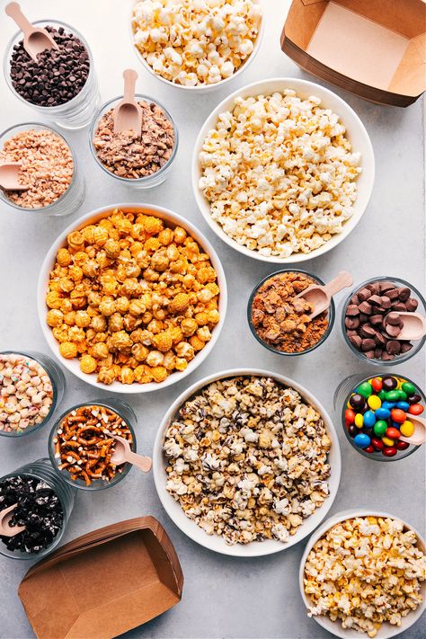 The BEST Popcorn Bar Popcorn Bar Toppings, Gourmet Popcorn Bar, Diy Popcorn Bar, Popcorn Buffet, Popcorn Theme, Popcorn Toppings, Savory Popcorn, Hosting A Party, Movie Night Popcorn