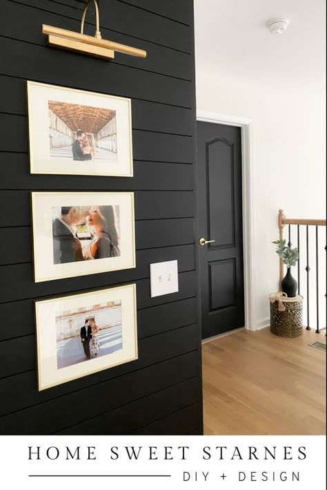 Black Wall Hallway Ideas, Black Shiplap Hallway, Bold Shiplap Wall, Small Accent Wall Hallway, Black Shiplap Wall Decor, Black Accent Wall With Picture Frames, Light Grey Walls With Black Accent Wall, White And Black Shiplap, Dark Tv Accent Wall