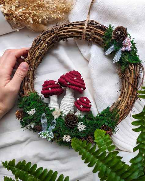 Enchanting woodland with pretty little detail 🍄✨🦋 This one's for all my fellow nature's loving buddies - brand new macrame mushroom wreath featuring cute macrame mushrooms, gorgeous clear quartz crystals, dried moss greenery and pine cones can be hung on a wall or placed on a shelf, will surely brighten your home! 🥰 >>> Just tap link in bio to shop! #macrame #wreath #wreathdecor #handmadewreath #macramewreath #mushroommagic #mushroomart #macramewallhanging #homedecor #whimsicalart #naturel... Wreath Macrame, Macrame Mushroom, Macrame Mushroom Tutorial, Mushroom Christmas Wreath, Wreaths With Mushrooms, Macrame Mushroom Ornament, Cottagecore Macrame, Mushroom Art, Handmade Wreaths